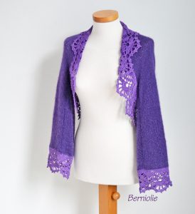Purple shrug with lace trim. N384