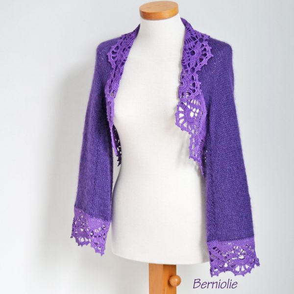 Purple shrug with lace trim. N384