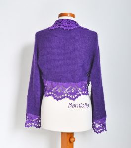 Purple shrug with lace trim. N384