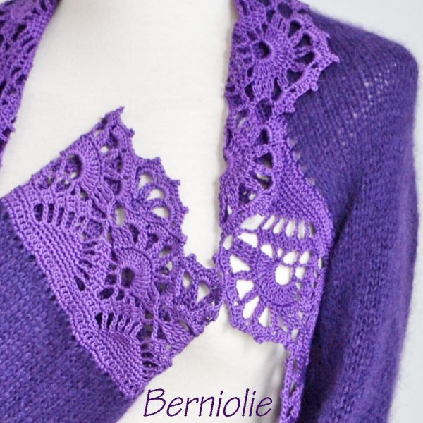 Purple shrug with lace trim. N384